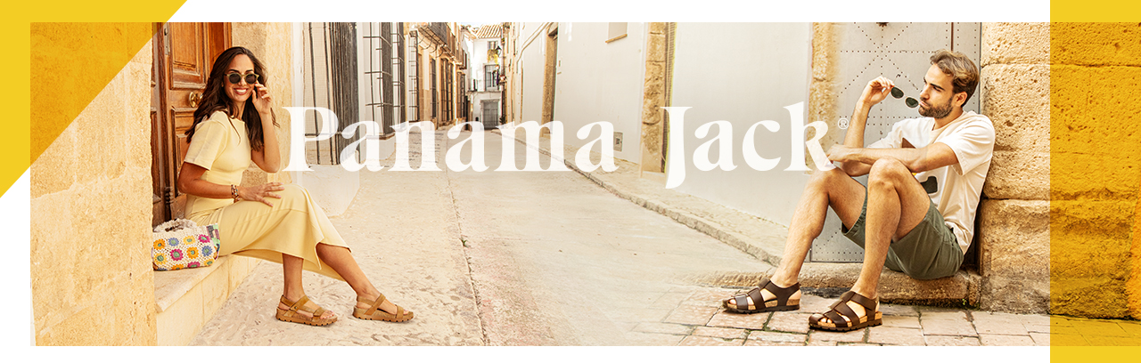 Mann und Frau sitzen und tragen Panama Jack Sandalen